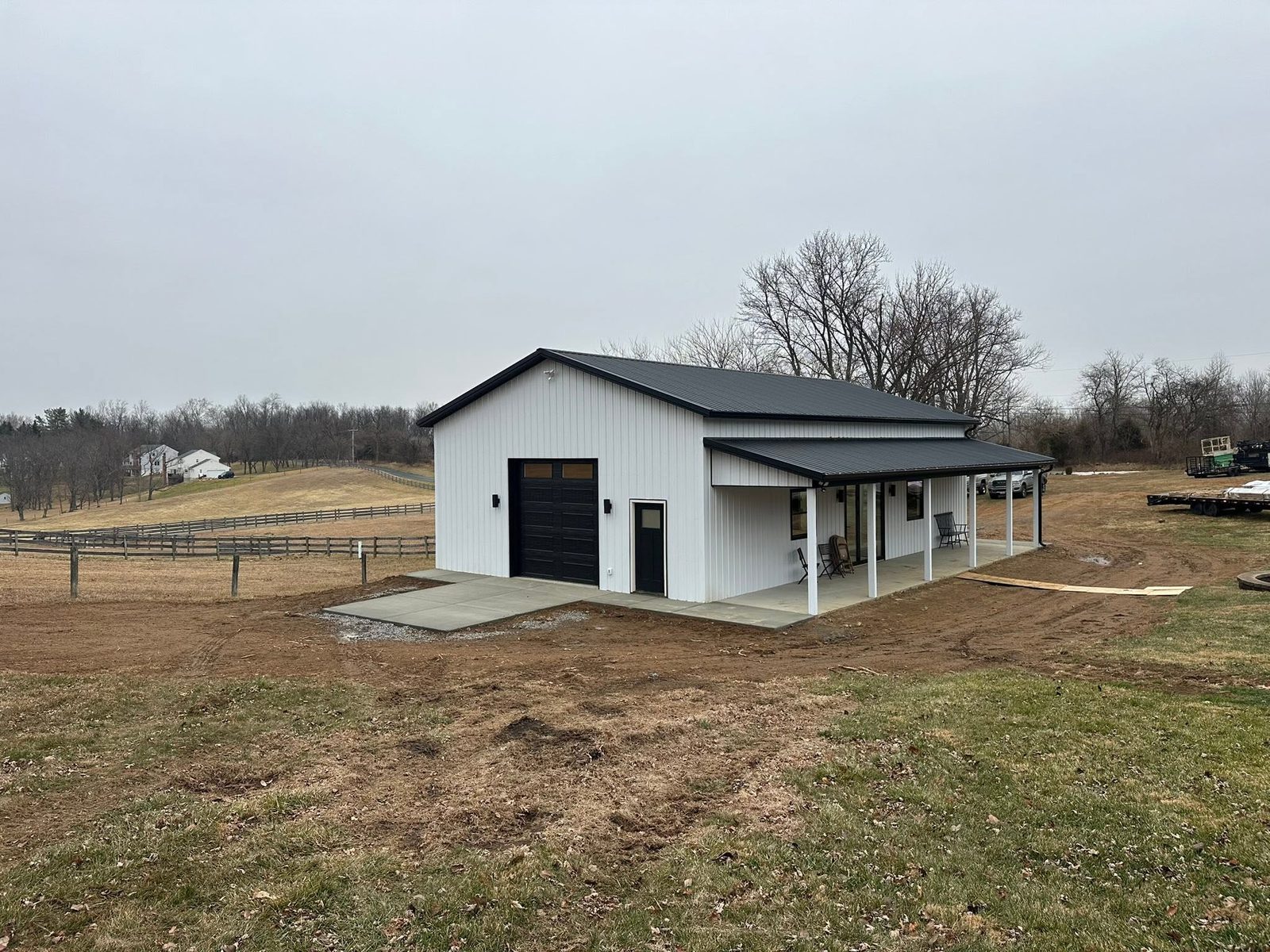 40x50 post-frame pole barn garage with maroon wainscot and two overhead doors in Frederick County, Maryland