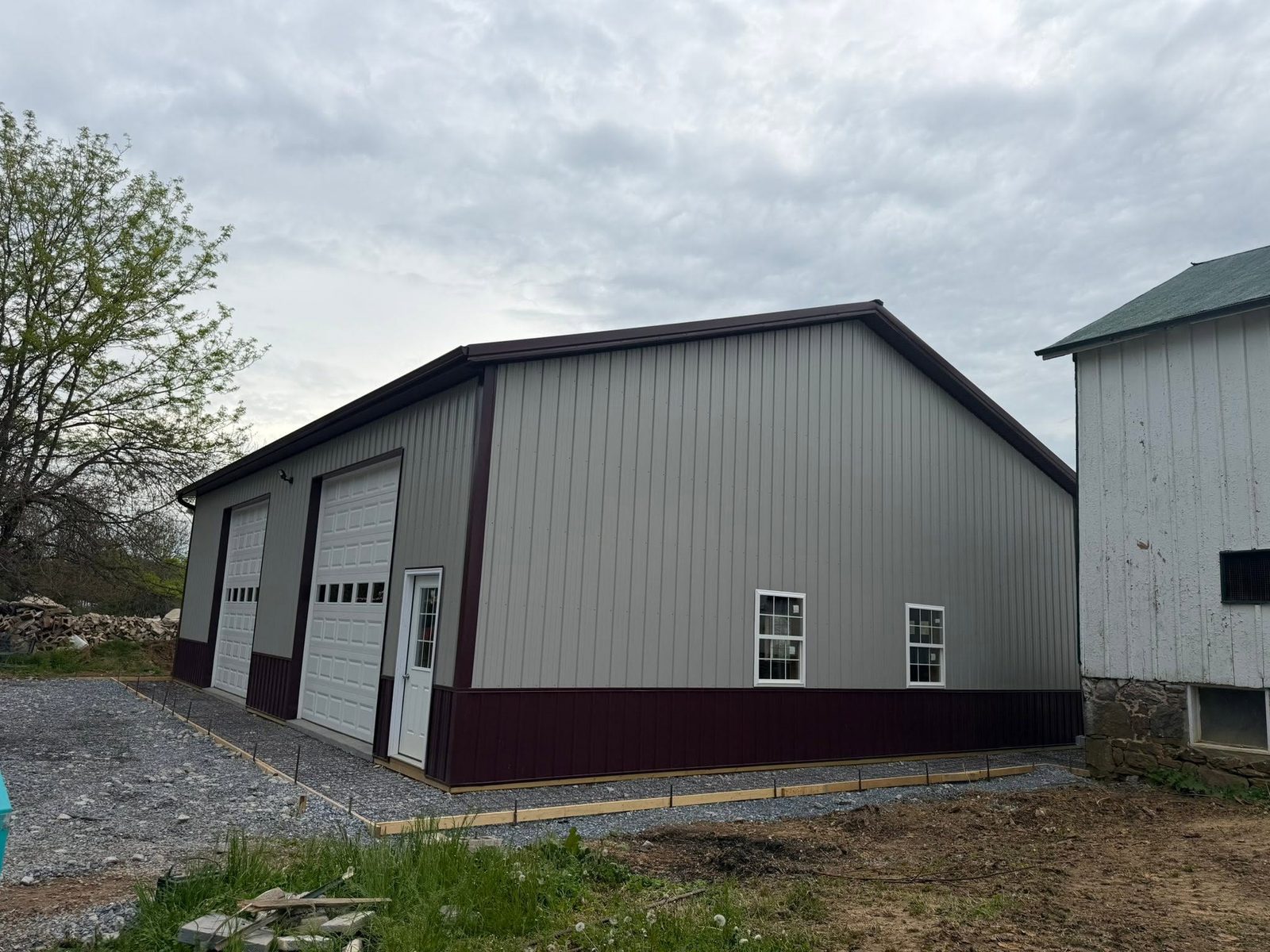 Large 60x68 pole building extension with multiple overhead doors in Woodsboro, Maryland