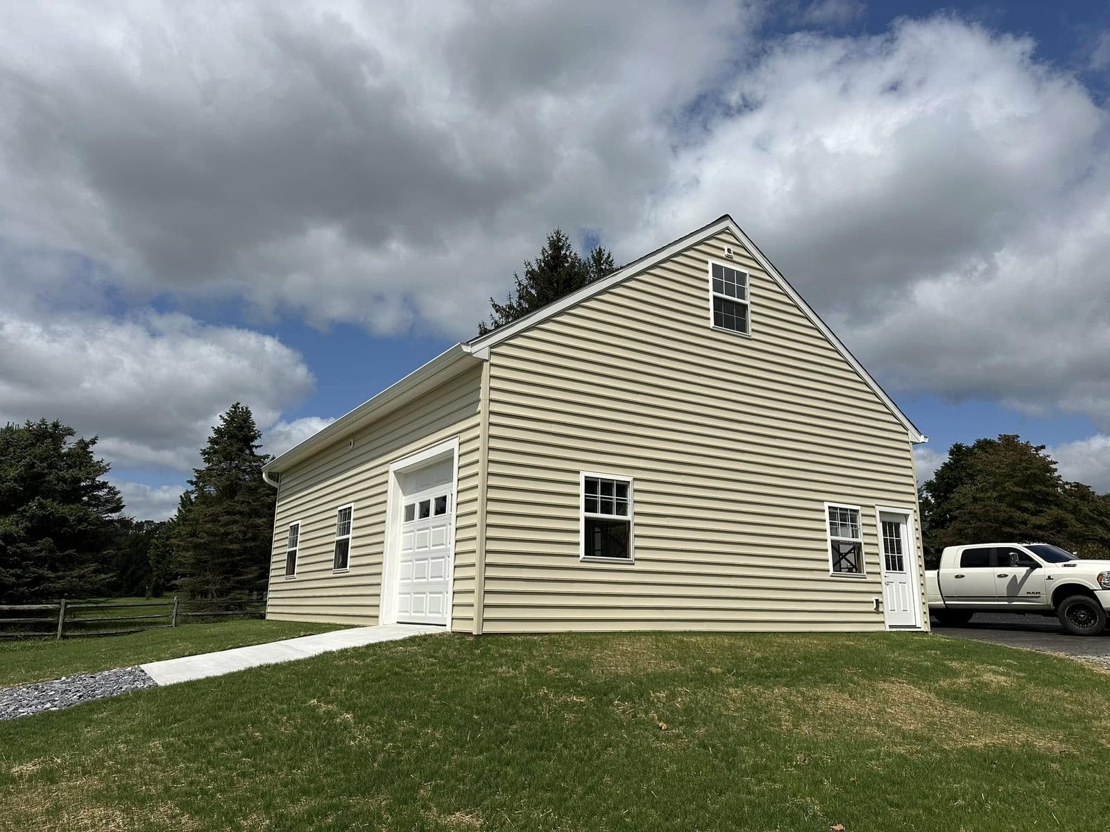 Two-story detached garage with vinyl siding and dormers in Mount Airy, Maryland