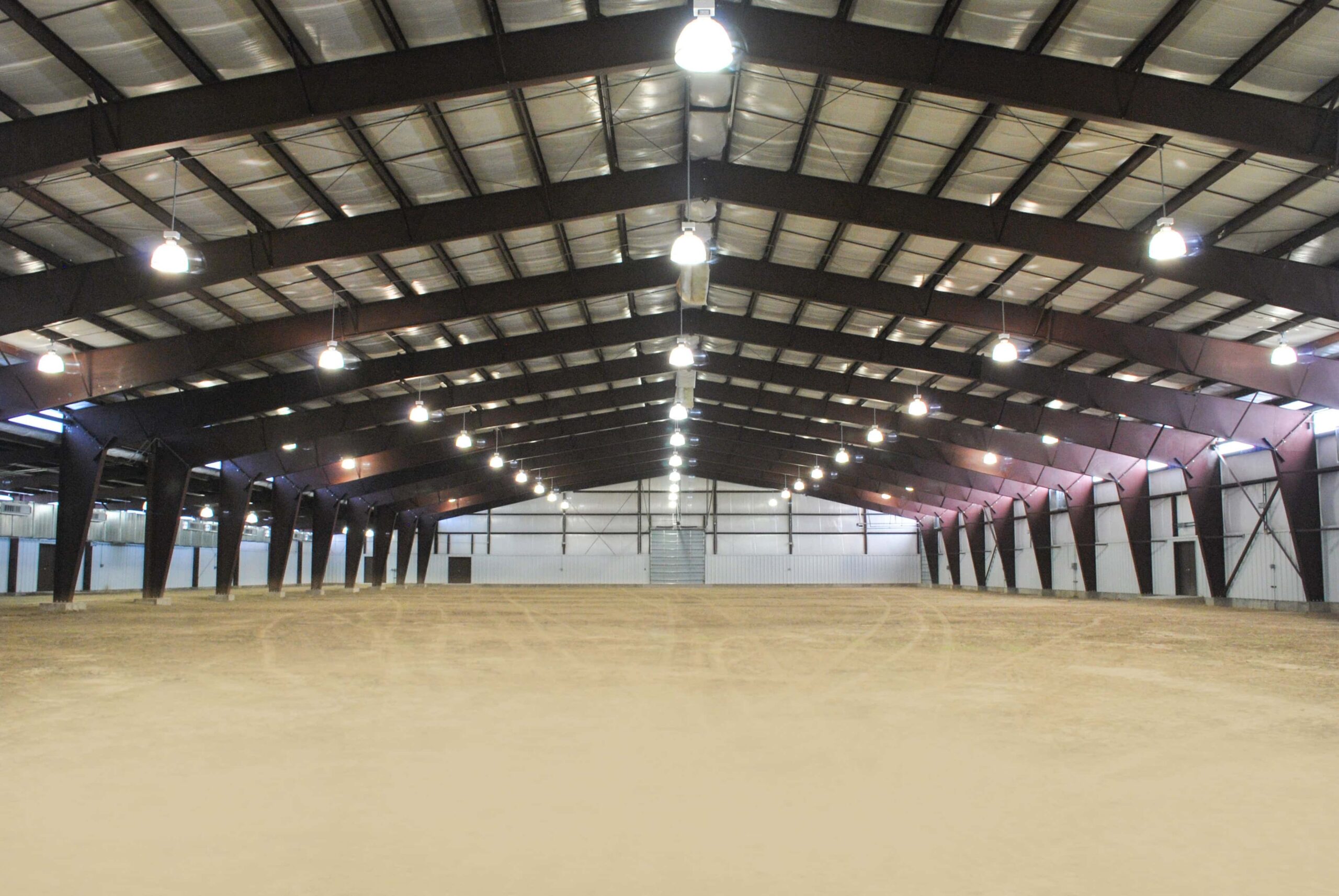 Clear-span post-frame riding arena interior built in Maryland