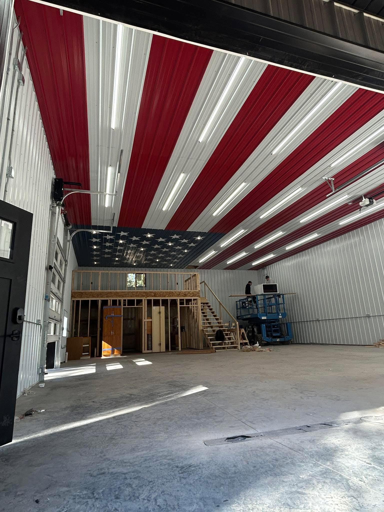 Custom workshop interior with an American flag metal ceiling, built by Pole Buildings Plus in Maryland